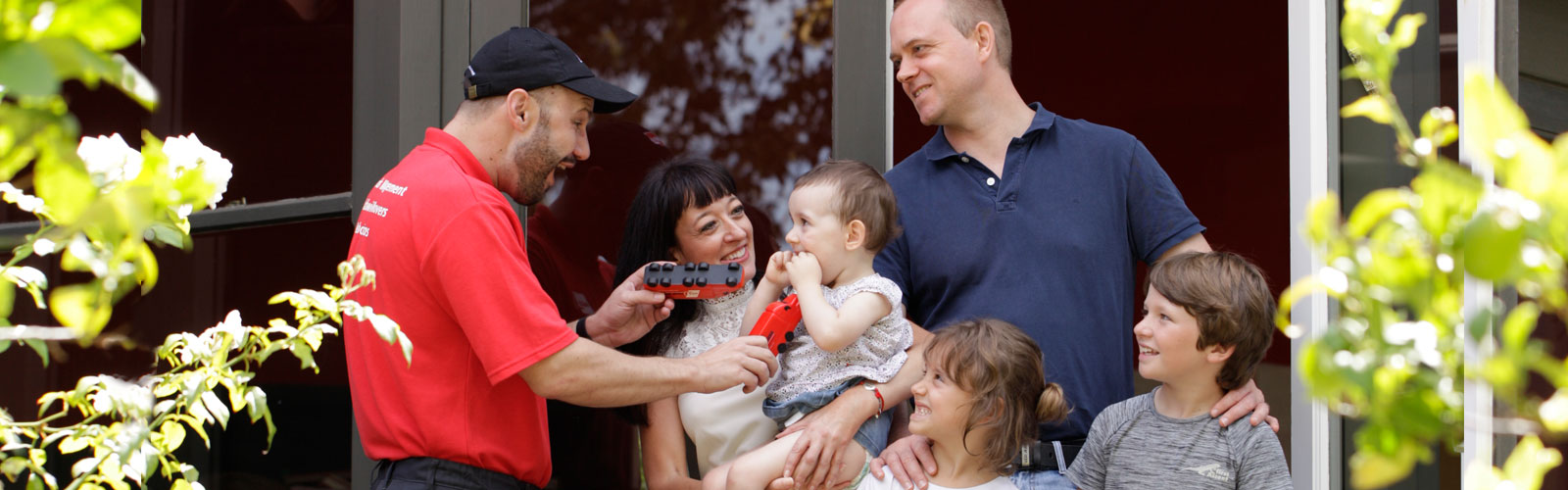 Happy family talking with a mover